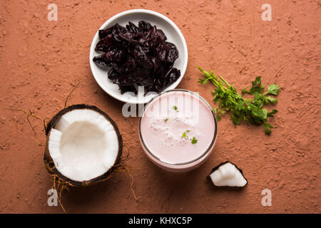 Solkadhi OR Kokum curry, A famous drink from Goa or Maharashtra`s Konkan region, served in a glass over moody background, selective focus Stock Photo